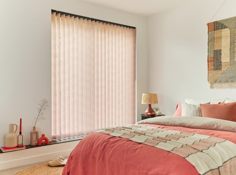 Arena Rhonda Paprika fabric vertical blinds in a bedroom