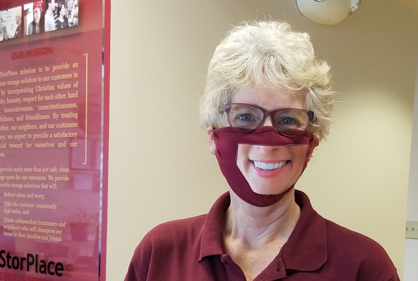 Lana wear a mask with an image of a smile to give the appearance that she is grinning