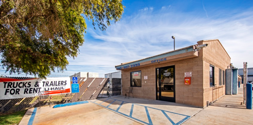 The front of StaxUP Storage - Portico, with a U-Haul banner advertising trucks and trailers for rent.