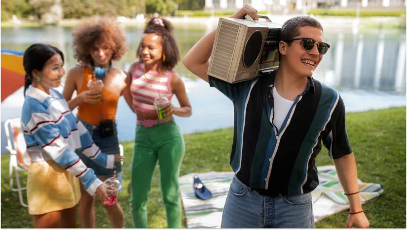 friends in park with a boom box and fun outfits of various colors