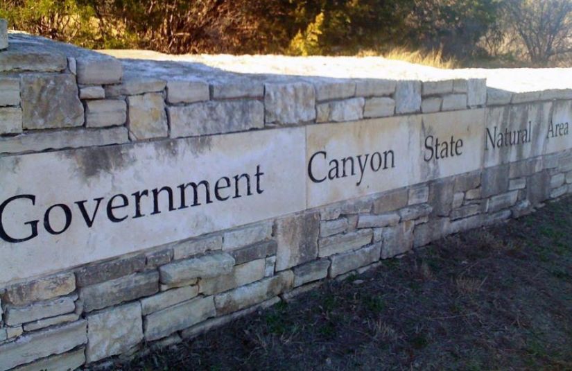A stone wall with text reading "Government Canyon State Natural Area."