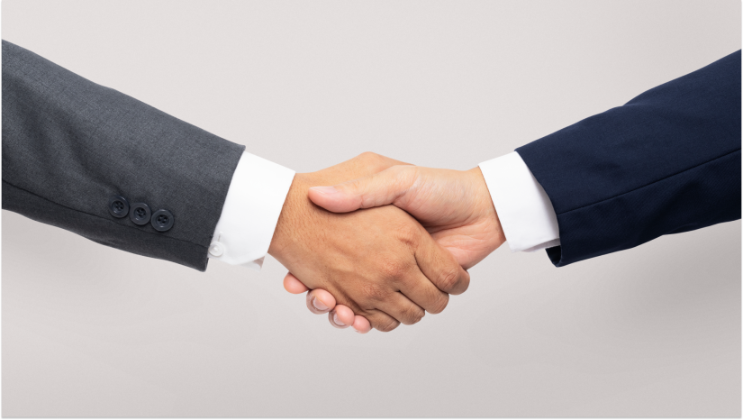 handshake two people in business suites