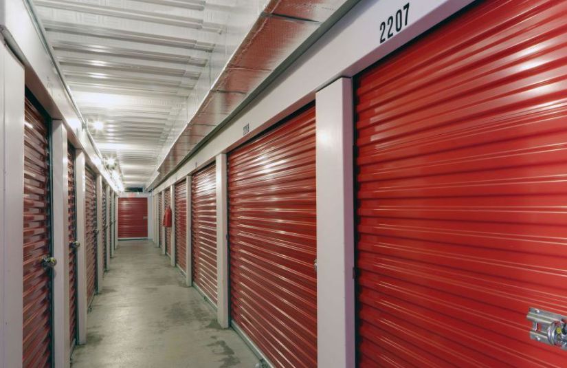 A hallway lined with storage units.