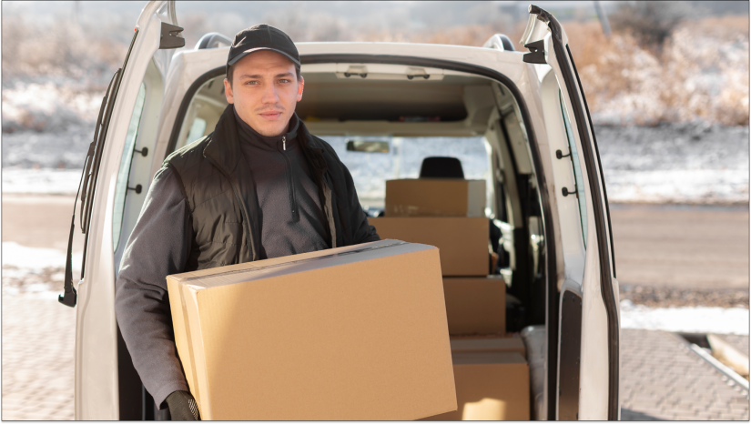 man with storage boxes by car doors