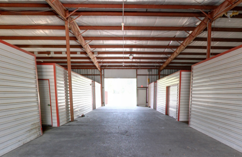 A covered breezeway with several storage units.