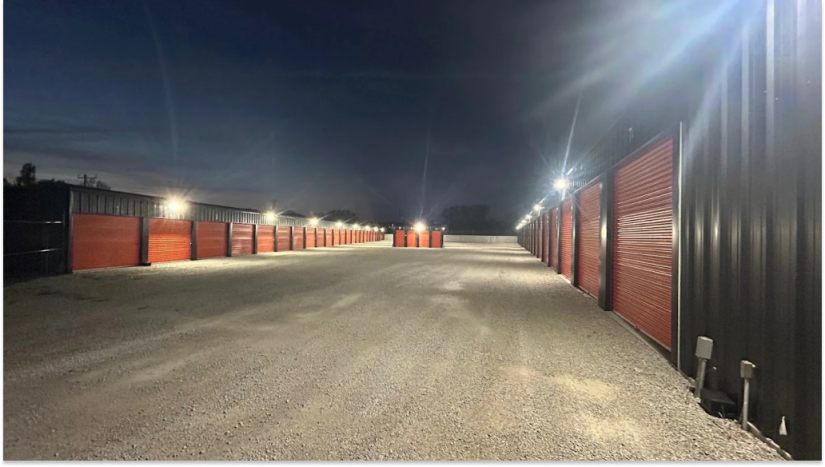 Drive-up storage unit with roll-up door at a storage facility