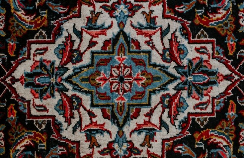 An ornately patterned rug seen from above.