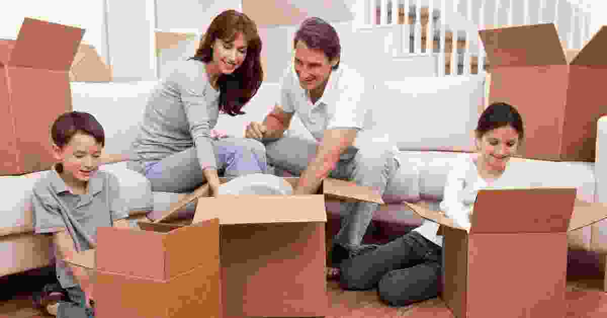 Family Unboxing Moving Boxes