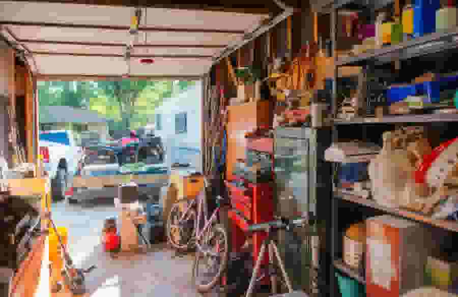 Overflowing Garage with Garage door open