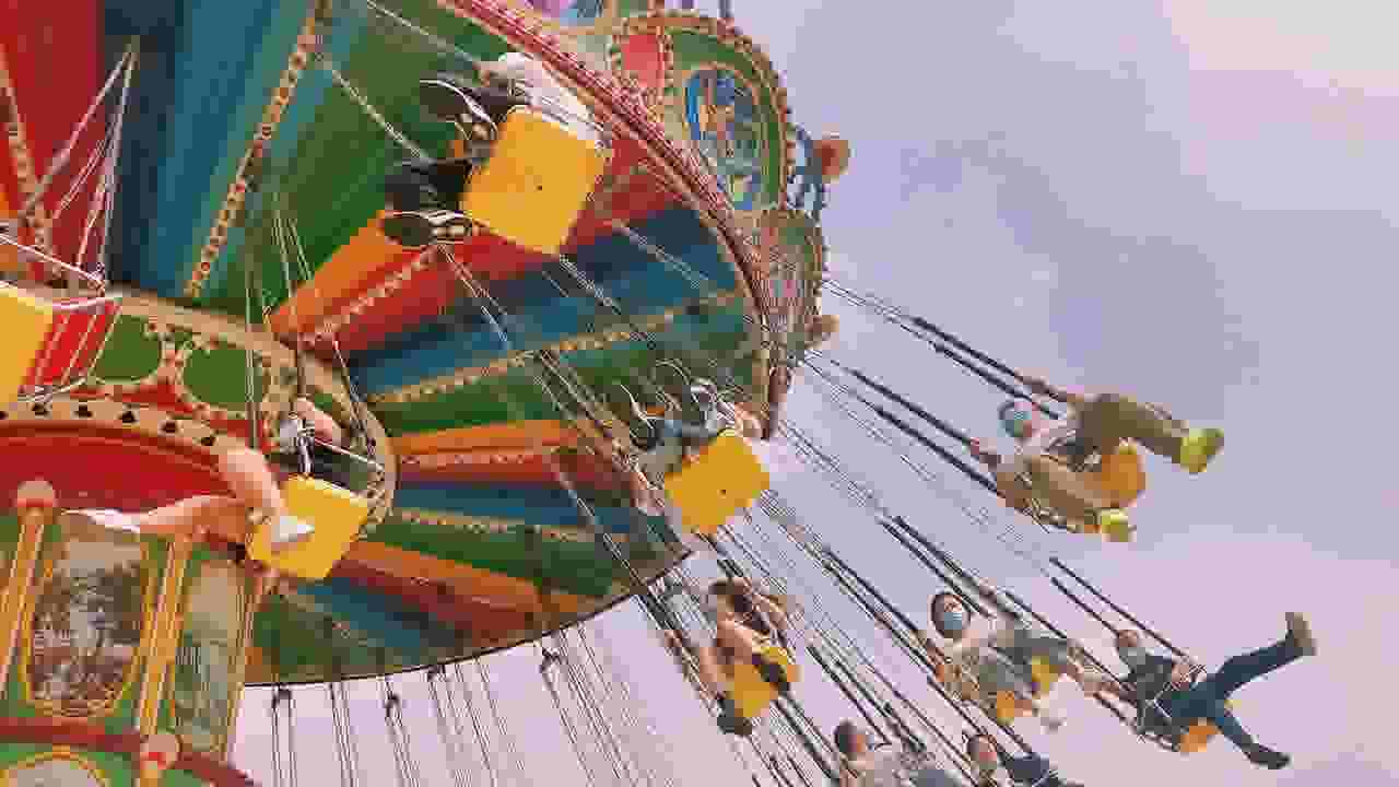 amusement park ride people in large swings in tulare, ca