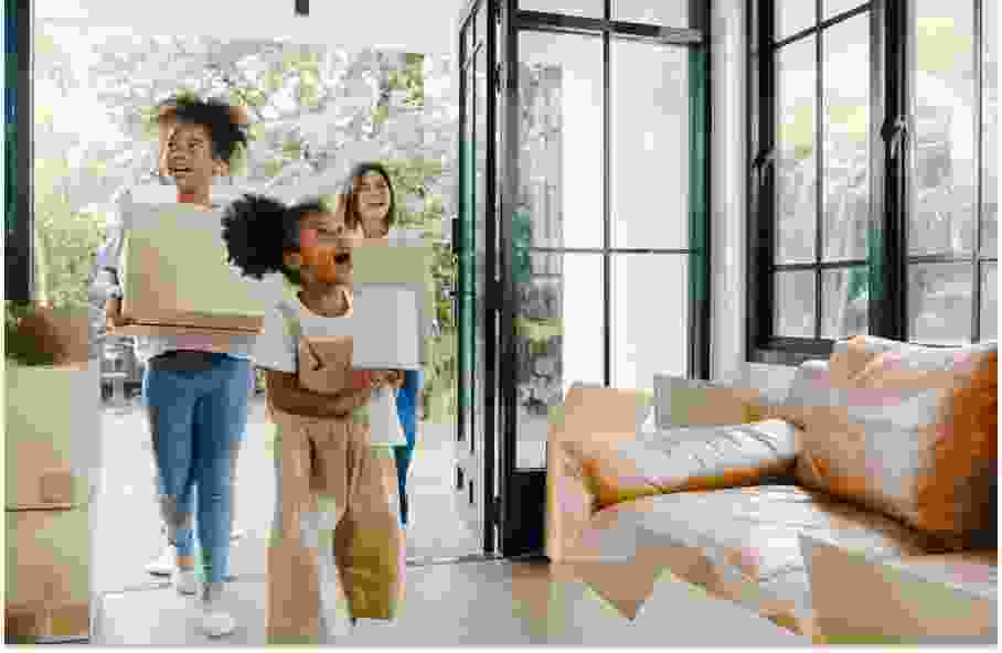 family moving into home with storage boxes