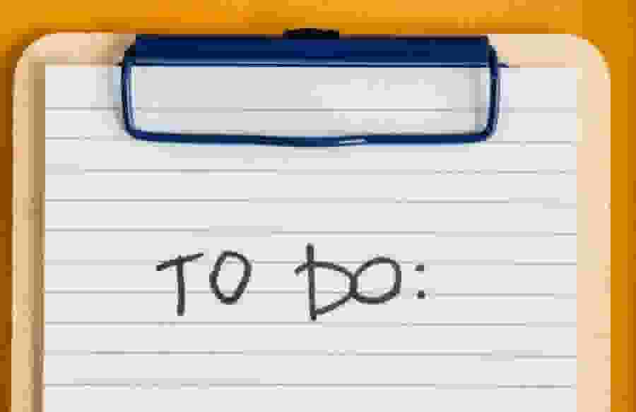 A clipboard with a note that reads "TO DO:"