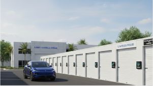 blue car driving up to drive up climate controlled storage unit