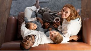 family sitting on couch together