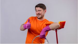 man cleaning with thumbs up