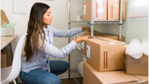 Woman in storage office around boxes