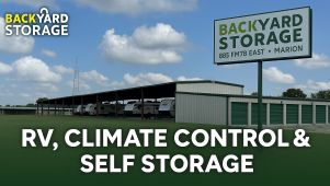 Wide exterior view of Backyard Storage in Marion, TX with a promotional one-line offer displayed over the facility background.