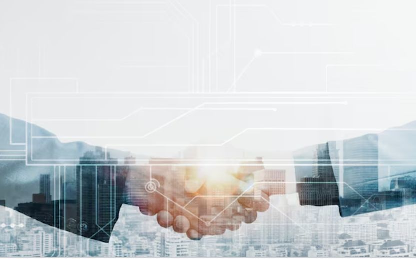 shaking hands wearing suits with backlighting