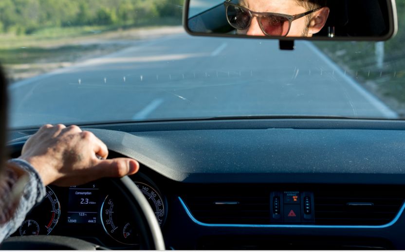 man driving on a street