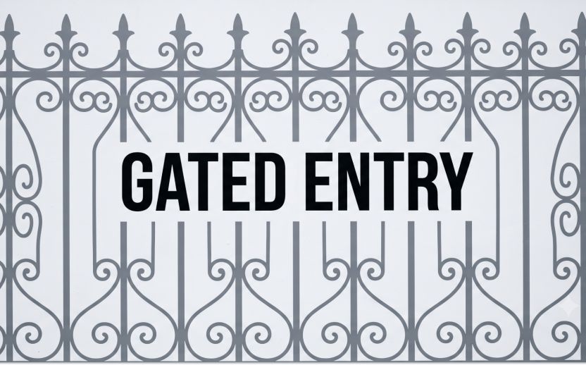 graphic of a fence in gray with black text saying gated entry