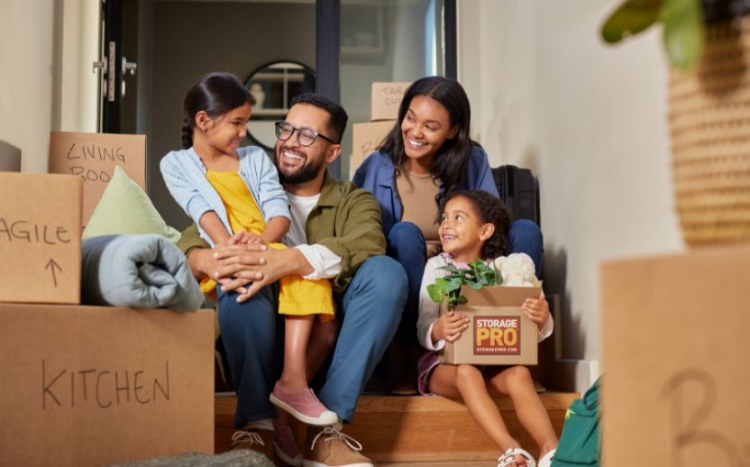 Photo of Family With Moving Boxes - Personal Storage Units - StoragePRO
