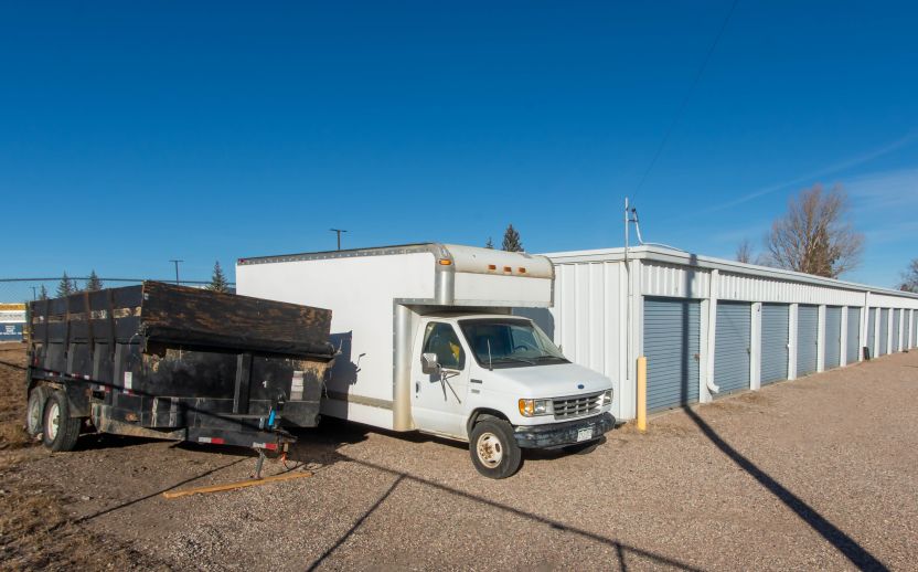 A white RV parked in All-rite storage in day light