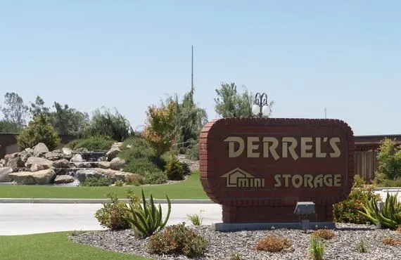 This picture shows a brick sign reading Derrel's Mini Storage outside of our 10948 Snow road location in Bakersfield California