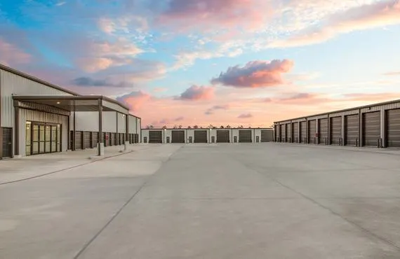 The doors of exterior drive-up storage units and the entrance to the interior storage building.