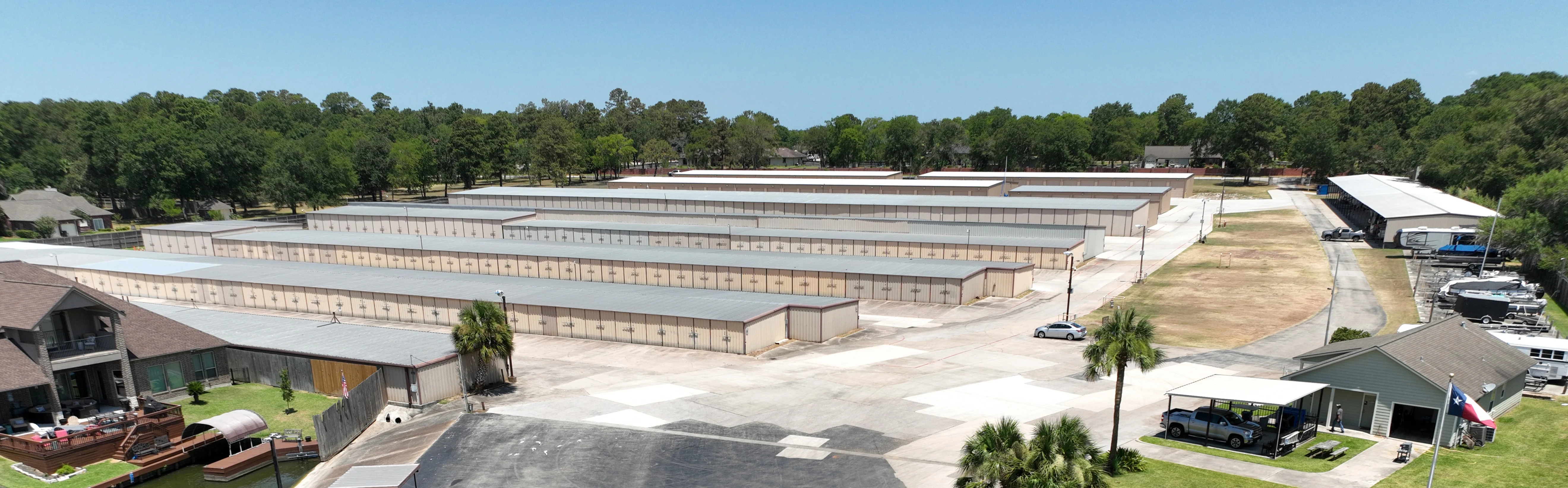 Aerial view of property showing the aisles of drive-up units, parking, and boat launch