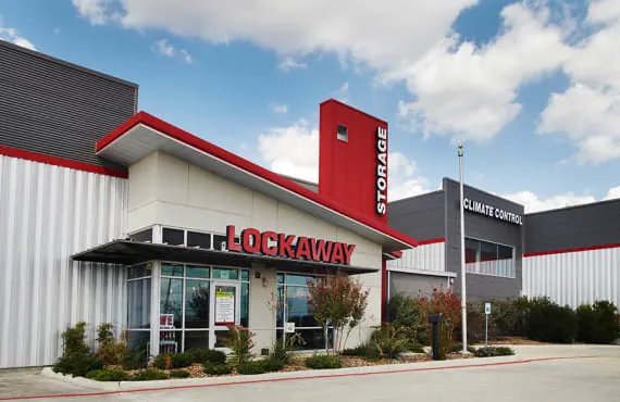 The front office of the property. Signs are visible advertising climate control and moving boxes for sale.