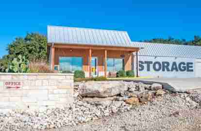 The front office of the storage facility. Part of a storage building is also visible.