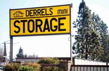 This image shows a sign reading Derrel's Mini Storage