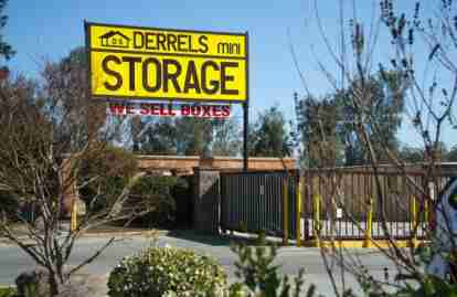 This image shows a sign reading Derrel's Mini Storage