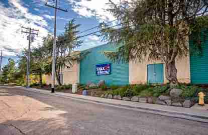 The front of the property. A StaxUP Storage sign is mounted on the front office building.