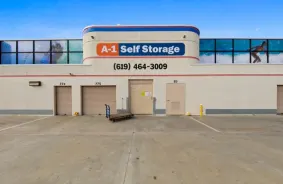 The front of the A-1 Self Storage building, with a dolly parked outside.