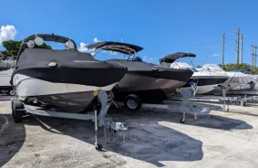 A row of boats parked in a parking lot for boat storage in Miami and Doral
