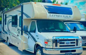 Beige RV being Stored inside J and D Parking Storage