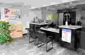 interior of front office with moving supplies on wall