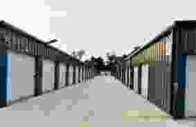 Hallway image of storage units at self storage property Locked Tight Storage, 103 Village Dr, Diana, TX, 75640