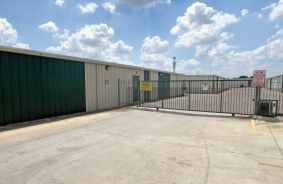 gated entrance with drive-up units behind the gate
