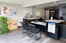 interior of front office with moving supplies on wall