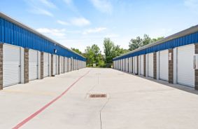 Spacious Driveway in Between 2 Storage Buildings