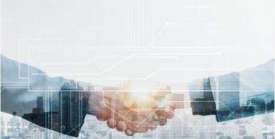 business men shaking hands with blue color behind them