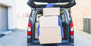 holding boxes vertically outside of a car