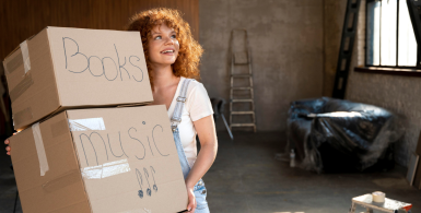 Women carrying 2 boxes for storage