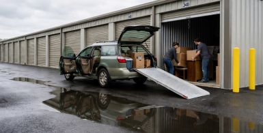 Car parked at a drive-up storage unit for easy loading and unloading