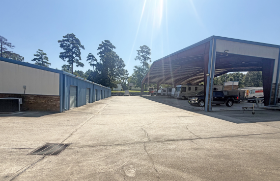 Left side has a row of drive-up units and one the right side is covered parking