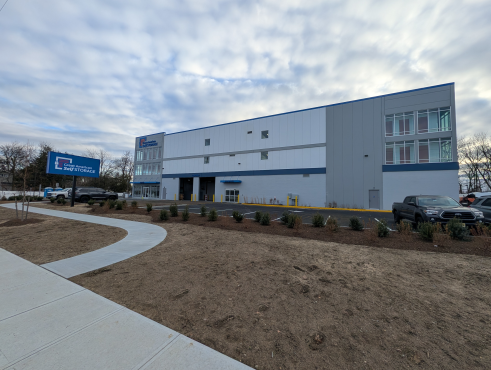 This image shows the sign in front of the self storage facility reading Great American Self Storage