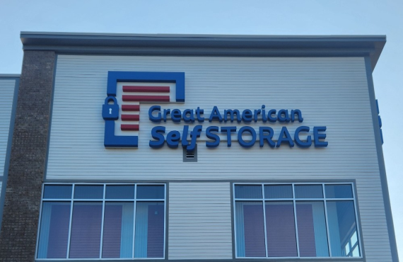 This image shows the sign in front of the self storage facility reading Great American Self Storage