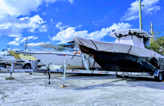 Rows of boats on trailers parked in storage